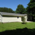 Newly Installed Roof, Fence, and Outer Green Area