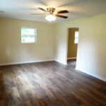 Woodwork on Floor and Designer Fan with Illuminated Lights