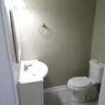 One Touch Flush Toilet and Designer Lights on Mirror for Bath Upgrade