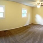 Long and Spacious Common Area with Carpet in the Home