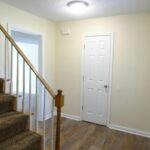 Stairs with Rug, Railing, and Upgraded Lights