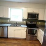 White Painted Cabinets, Countertops, Faucet, and Appliances