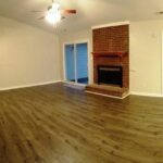 Brick Fireplace in the Large Living Room with Illuminated Fan