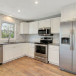 Brand New Kitchen with Custom Back Splash Tile, Quartz Tile, and New Appliances