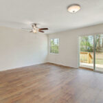 New Floor for the Living Room with Long Glass Window and Outer View