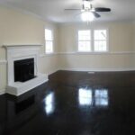 Black Colored Real Wood Floor and Fireplace in the House