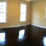 Reflections of Three Windows on the Real Wood Floor in the Room