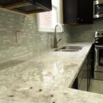 Drop down Faucet, Tiles on Wall, and Concrete Platform for Kitchen