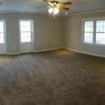 Interior View of the Master Bedroom with Lights On