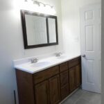 Two Faucets, Rectangular Mirror, and New Paint for the Bath Makeover