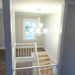 Illuminated Lights Attached to the Ceiling and Hickory Wood on Steps