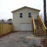 A Detached Garage, Stairs, and Fenced Premises