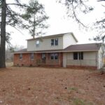 Brick Home, New Roof, and Few Large Trees at the Front