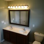 Large Size Mirror and One Touch Flush for Upgraded Bath