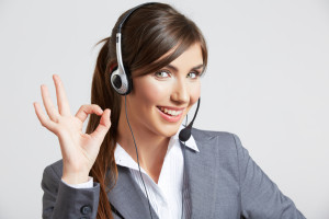 A Young Woman in Suit Wearing Headphone and Smiling