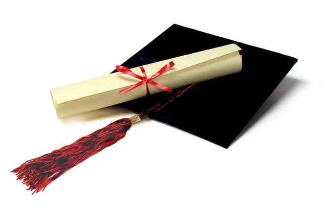 Graduation Hat and a Roll of Paper