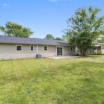 Spacious Backyard of the Home with Trees and Lot