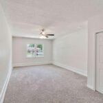 Granite Counter, Living Area, and Large Window with Outer View