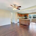 New Flooring Towards Kitchen with New Stainless Appliances