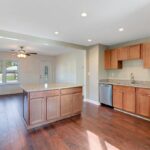 Remodeled Island Kitchen with Lots of Lights and Cabinets