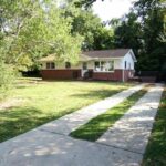 Big Trees and Vegetation at Front of the Home