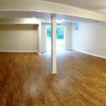 Basement Floor Remodel with White Painted Pillars