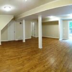 Decorated Walk in Basement Area with Lights and Pillars