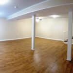 White Painted Walls and Pillars in Redesigned Basement