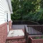 Open Deck Area with Dense Vegetation Outside