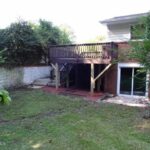 Raised Deck, Lot, and Vegetation Near Home Exterior