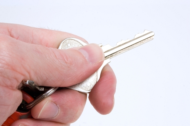 A Person Holding a Key, Blog Page of Blue Hen Homebuyers