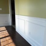 A White and Yellow Color Wall With Wood Flooring