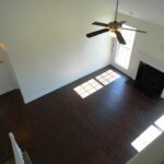 View of the Fan, Floor, Fireplace, and Walls from Above