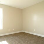 An Empty Remodeled Room with New Paints and Flooring