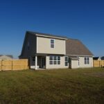 House with a New Privacy Fence in the Backyard