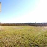 Long View of the Fence Around the Home and Lot