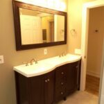 Upgraded Mirror, Faucets, and Cabinets for the Bath