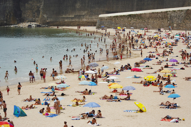 People Spending Relaxed Time on a Beach on a Summer Day