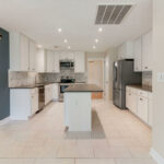 New Kitchen with Quartz Counters and Custom Tile Back Splash