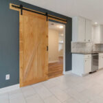 Sliding Door, Painted Wall, and Side View of Kitchen