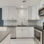 Kitchen with New Cabinets, Painted Walls, and Appliances