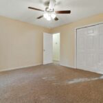 Fan with Lights, White Painted Cupboards, and Empty Redone Room