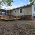 Fully Fenced One Story Home with Empty Lot and Trees