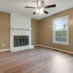 A Remodeled Room with Floor Work, Fancy Fan, and A Window