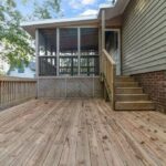 Wood Work for Multi Level Deck with View of Backyard