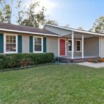 Trimmed Grass in the Front Yard of A Big House