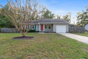 Beautified Tree in the Front of One Story Redesigned Home