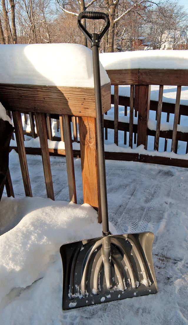 Snow Shovel and Wooden Structure at a Real Estate Property