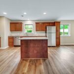 Ceiling Lights, Kitchen Island, and Remodeled Floor in the House