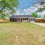 Big Trees on the Empty Lot in Front of the Redesigned House